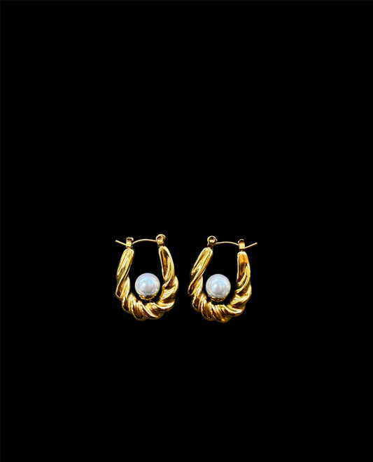 Gold U-shaped earrings with a pearl centerpiece, featuring an elegant twist design