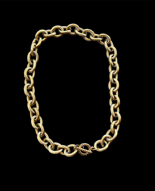 Chunky gold necklace with a toggle clasp closure